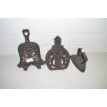 Two cast iron trivets and a flat iron