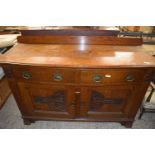 Late Victorian oak bow front side board with carved decoration