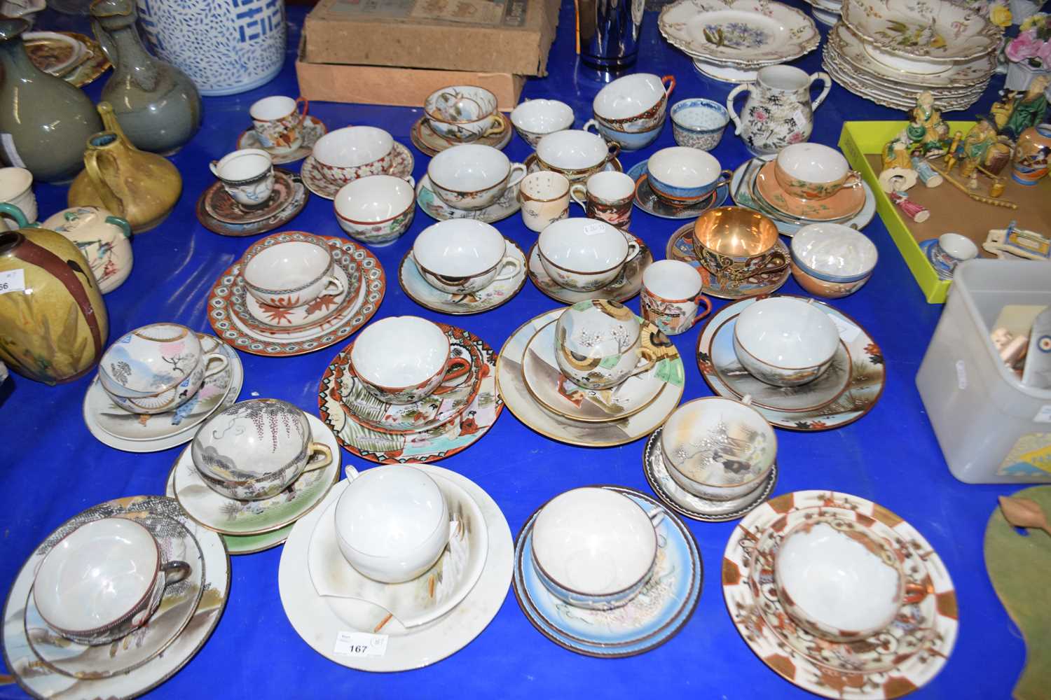 Large collection of Japanese eggshell teacups and saucers