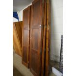 Selection of stained pine panelled interior folding doors