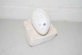 Composition model of an egg on plinth base