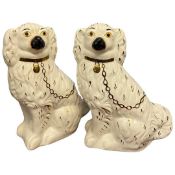 Pair of Staffordshire dogs decorated in typical fashion