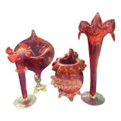 Group of four Victorian Cranberry glass vases