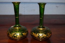 Pair of 19th Century small bohemian type glass decanters with gilt foliate decoration (some wear)
