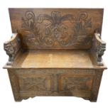 Late 19th / Early 20th Century oak monks bench with gothic carved detail and storage base, 106cm