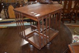 Early 20th Century mahogany revolving table top bookcase of square form, 35cm wide