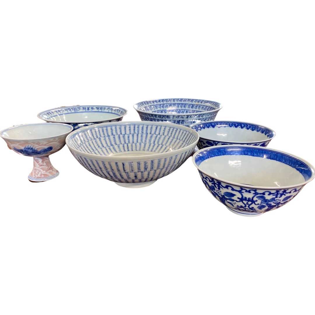 A group of five Chinese bowls with blue and white and polychrome decoration and a further Chinese
