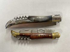 Plastic bag containing two Laguiole penknives with corkscrew fittings