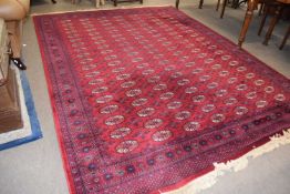 20th Century red Bokhara rug of large proportions, 273 x 367cm