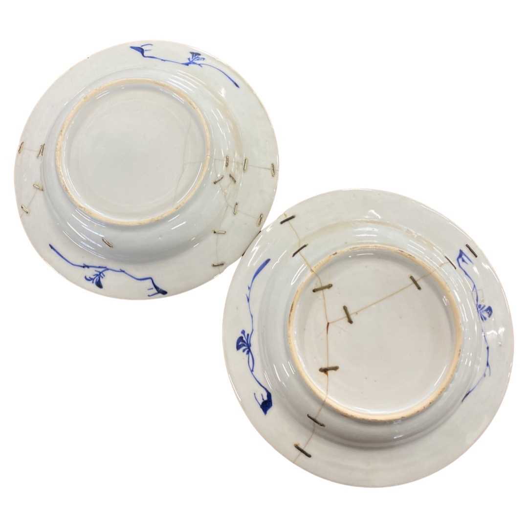 Pair of small 18th Century Chinese porcelain dishes with blue and white designs (riveted repairs) - Image 2 of 2