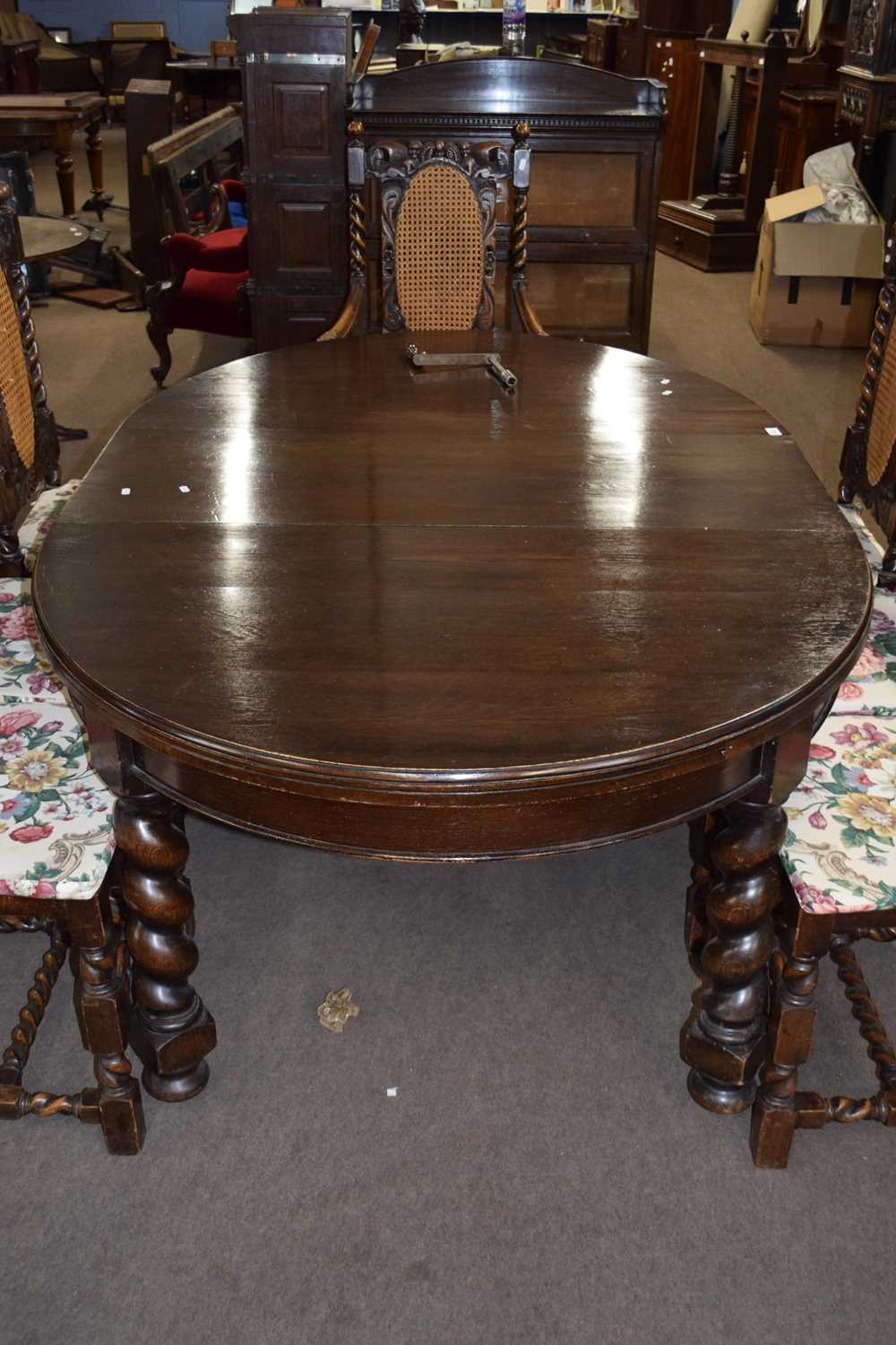 Early 20th Century oval oak extending dining table on barley twist legs