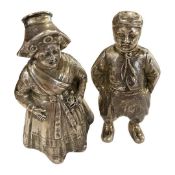 Pair of white metal condiments formed as a boy and girl