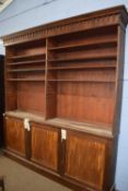 Large 19th Century mahogany bookcase cabinet with moulded cornice over an open top section with