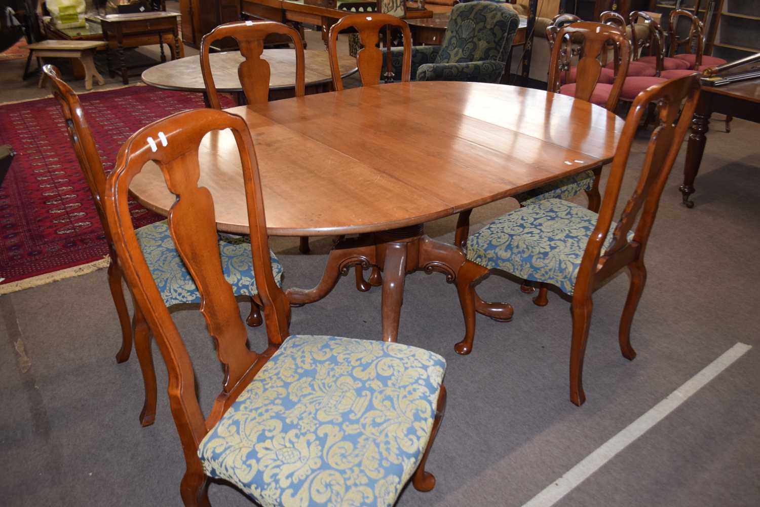 Bylaw of Norwich reproduction oval pedestal dining table and six accompanying cabriole legged chairs