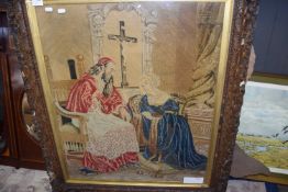 19th Century needlework picture, a lady kneeling before a Priest set in a carved wooden frame 83 x