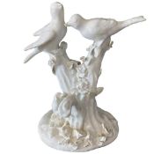 Bow porcelain blanc-de-chine figure of birds in branches with dog below (repairs and extensive