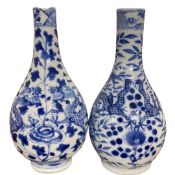 Pair of Chinese porcelain bottle vases with blue and white design of dragons, 15cm high (chip to rim