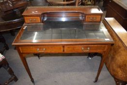 Edwardian mahogany and inlaid writing table with galleried back and four drawers raised on