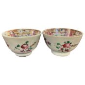 Pair of 18th Century Chinese export porcelain tea bowls with polychrome decoration of flowers