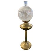 Brass oil lamp with floral glass shade