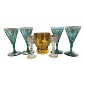 Group of glasses including a amber Bavarian type glass engraved with a golfing scene together with