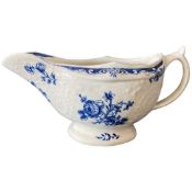 Lowestoft porcelain sauce boat with blue printed floral designs (hairline to rim)