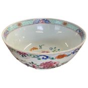 18th Century Chinese porcelain bowl with polychrome floral designs (restoration to rim), 24cm