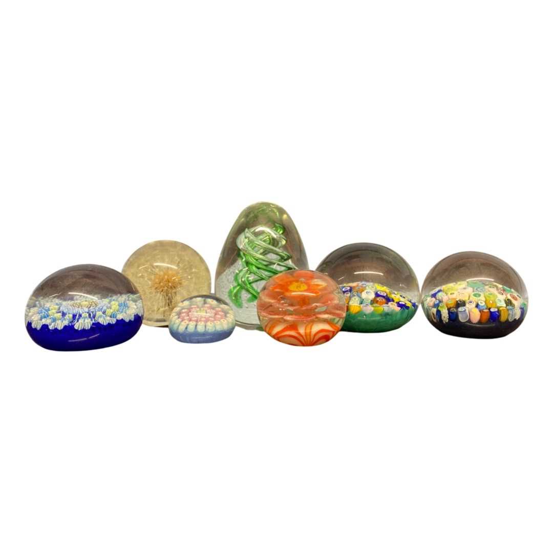 Group of seven paperweights, various designs