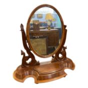 Victorian dressing table mirror with oval mirror plate, scrolled side supports and a bow front