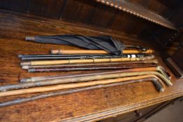 Collection of various assorted walking sticks to include horn handled and ebony examples plus a