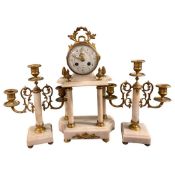 Clock garniture with candelabra on onyx bases and cylinder clock marked Rouen