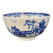 Lowestoft porcelain tea bowl with blue and white chinoiserie design (hairline to rim)