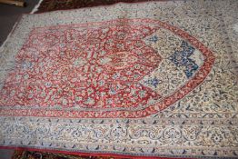 20th Century Isfahan wool and silk rug decorated with a stylised floral design, 246cm x 175cm,