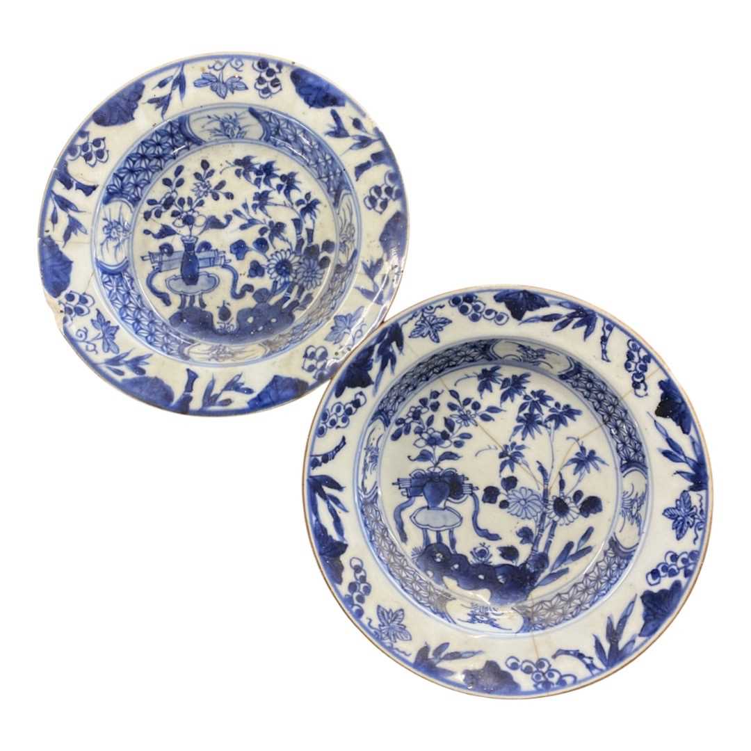 Pair of small 18th Century Chinese porcelain dishes with blue and white designs (riveted repairs)