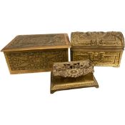 Group of three graduated brass boxes with various classical and foliate designs