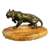 Spelter model of a tiger on oval onyx ashtray base