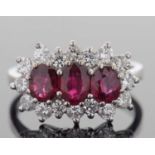 18ct white gold ruby and diamond ring design featuring three graduated rubies set within a brilliant