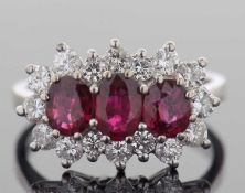 18ct white gold ruby and diamond ring design featuring three graduated rubies set within a brilliant