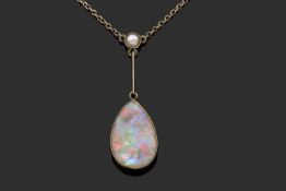 Vintage pear shaped opal pendant necklace, suspended from a knife edge bar and highlighted with a