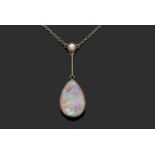 Vintage pear shaped opal pendant necklace, suspended from a knife edge bar and highlighted with a