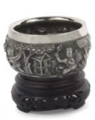 19th Century Indian/Burmese silver circular bowl heavily embossed with a continuous hunting scene,