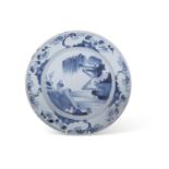 18th Century English delft dish probably Lambeth painted with a chinoiserie scene, 30cm diameter