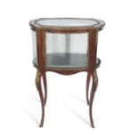 Late 19th/early 20th century French mahogany and metal mounted centre display cabinet of shaped form