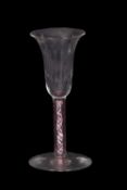 19th Century wine glass, the bell and bowl above a opaque twist stem with ruby collar twist, 15cm