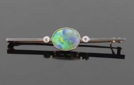 Opal and diamond brooch, the oval shaped opal 9x11x3.18mm, predominantly blues and greens, in a
