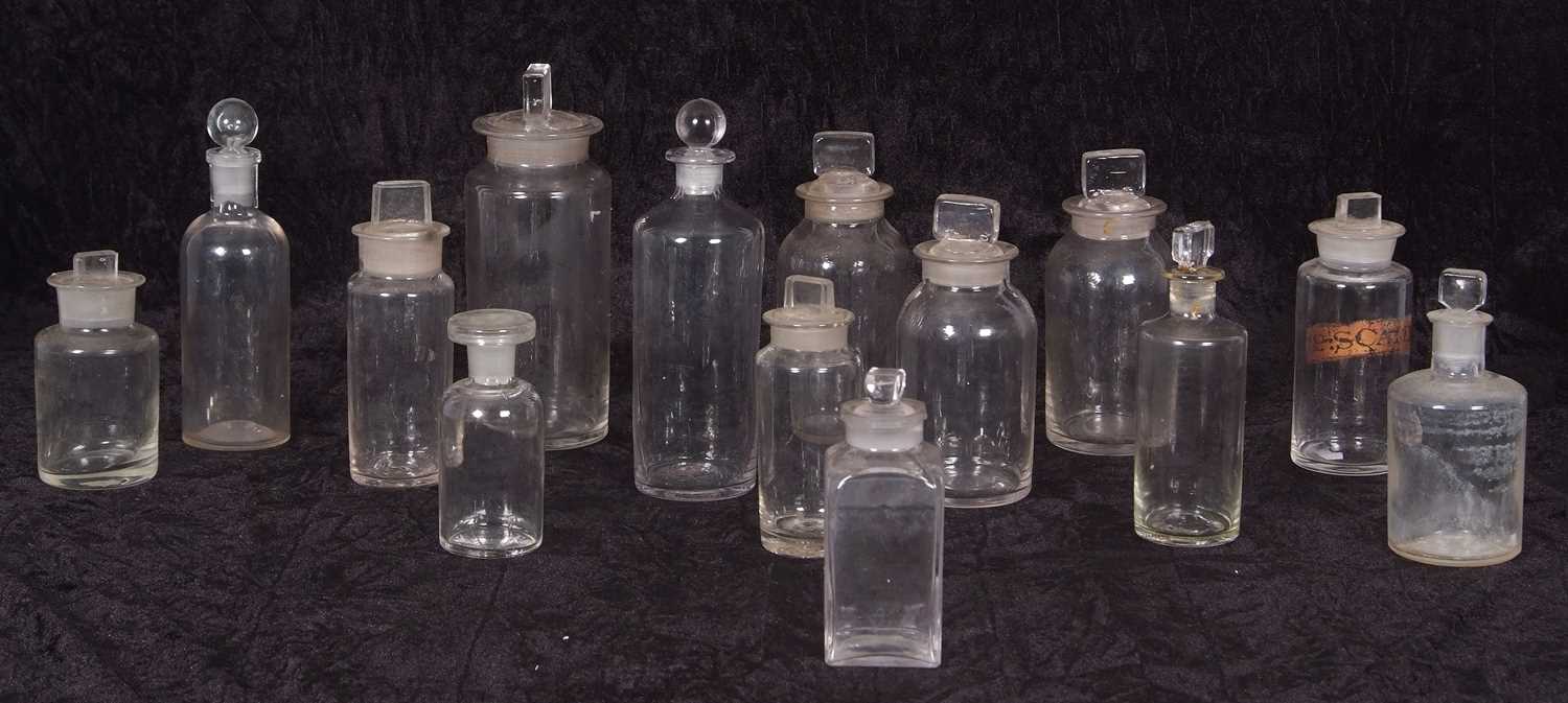 Quantity of small clear glass chemist bottles mostly with covers, some with original string cloth - Image 2 of 2