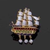 Clipper sailing ship brooch decorated with white, red, and green and blue enamels, with three