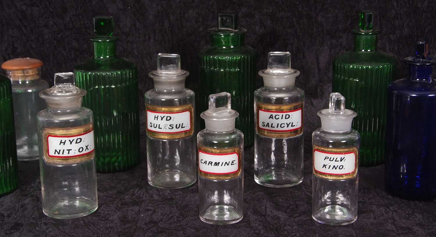 Quantity of clear glass and coloured glass chemist jars with covers or stoppers including four - Image 2 of 4