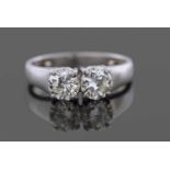 A Two Stone Diamond Ring featuring two round brilliant cut diamonds, individually claw set and