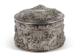 Late 19th/early 20th Century Chinese export silver circular lidded box heavily chased embossed